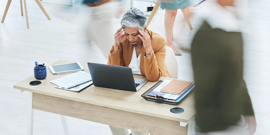 Women at desk in stressful environment