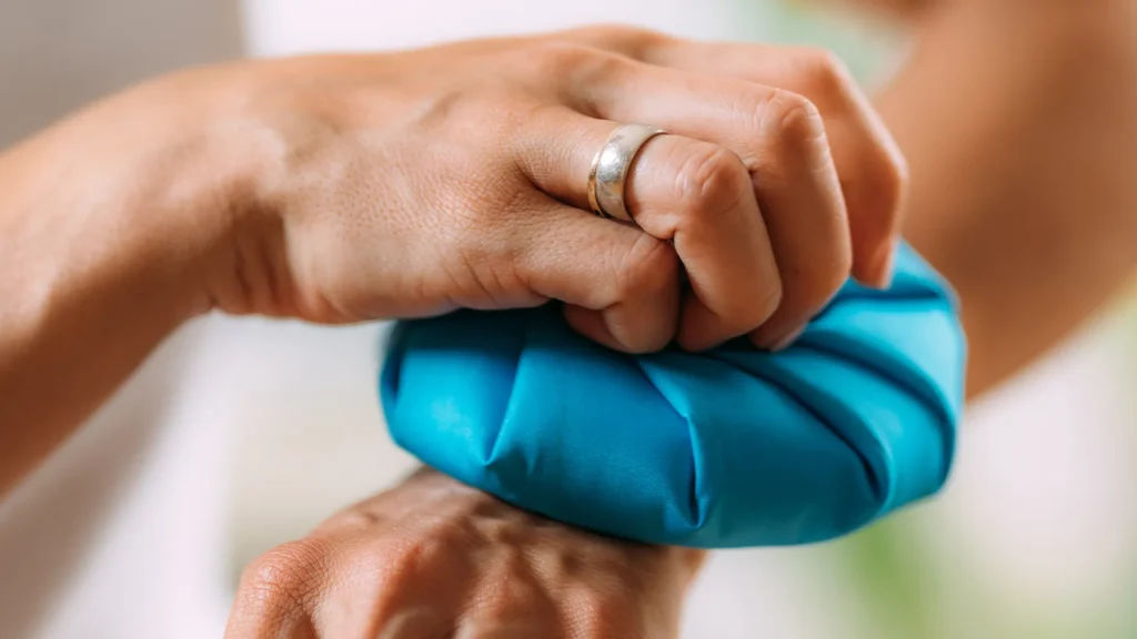 Person using ice pack to relieve the symptoms of arthritis